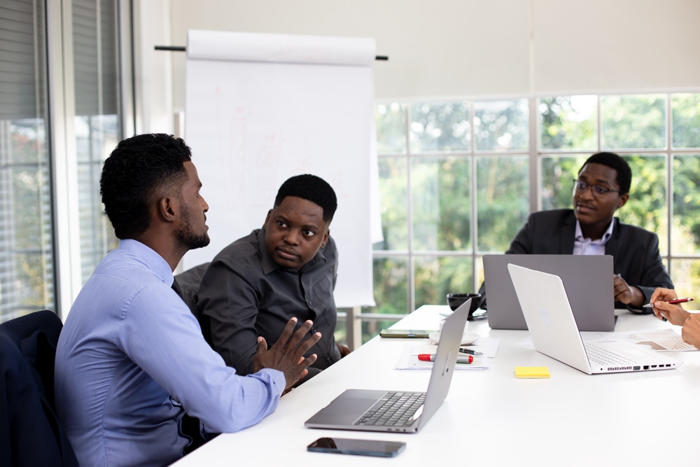 Team meeting representing business consulting services in Kenya at Hoffman Solutions